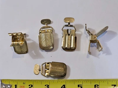 Lote de (100) clips de guantes con tirantes tono dorado Howard    Foto 1 de 4