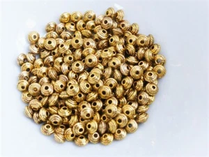 50 x Small Tibetan Silver Saucer Spacer Beads 5mm x 3mm Antique Gold LF/NF - Picture 1 of 1