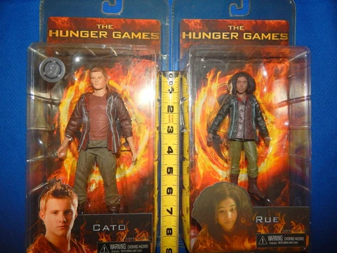 Lot of 2 The Hunger Games - Rue and Cato  Toys-R-Us Exclusive NECA Reel Toys NIP Cover