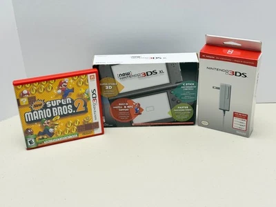 Nuevo sistema portátil Nintendo 3DS XL negro metálico paquete completo con nuevo Mario 2 Foto 1 de 4