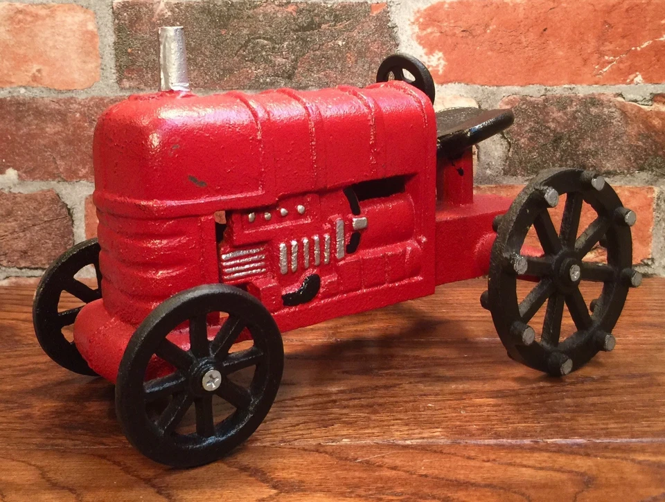 Juguete tractor agrícola rojo vintage de hierro fundido John Deere Foto 1 de 4