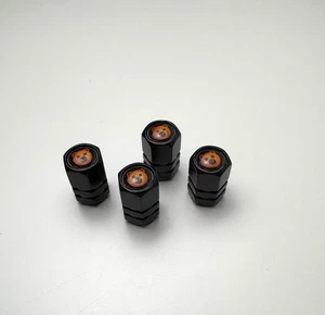 JUEGO DE 4 TAPONES ANTIPOLVO VÁLVULA NEUMÁTICO - OSO - NEGRO / NARANJA - Imagen 1 de 5
