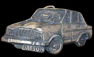 VINTAGE 1970'S 3D DATSUN FOUR DOOR SEDAN BELT BUCKLE - Picture 1 of 2