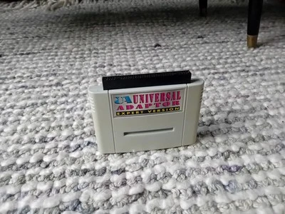 Datel UA Universal Adaptor Expert Version Super Nintendo SNES Cartridge PAL  - Image 1 of 4