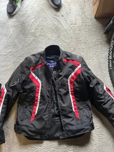 Black and red RST motorcycle jacket. Used but mint condition. Less than 10 rides - Picture 1 of 3