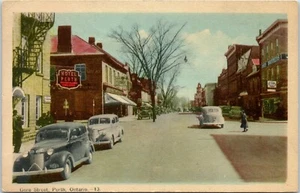 Postkarte Ontario Perth Gore Straßenansicht alte Autos Ford Schild Schaufenster verschickt - Bild 1 von 2