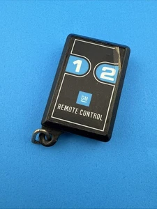 USED OEM GM 2-BUTTON REMOTE TRANSMITTER FOB CNA 756CA-UTX  - TESTED - Picture 1 of 3