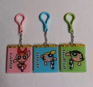 Juego de 3 libros dorados mini llavero etiquetas clips red de dibujos animados para niñas superpoderosas - Imagen 1 de 3
