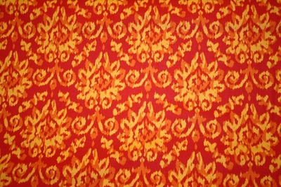 IKAT ESTAMPADO CHENILLA EN NARANJA, ROJO DE PATRICK LOSE - TELA 100% ALGODÓN Foto 1 de 4