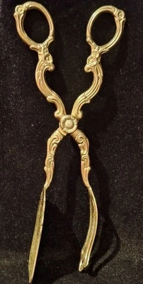 Pinzas para pasterio/sándwich plateadas con flores Buttercup Foto 1 de 4