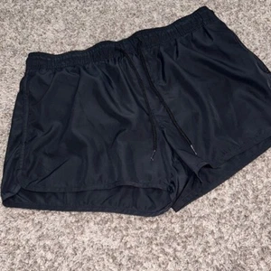 H&M schwarze Mesh gefütterte Laufshorts Kordelzug Gummibund Gr. Large - Bild 1 von 5