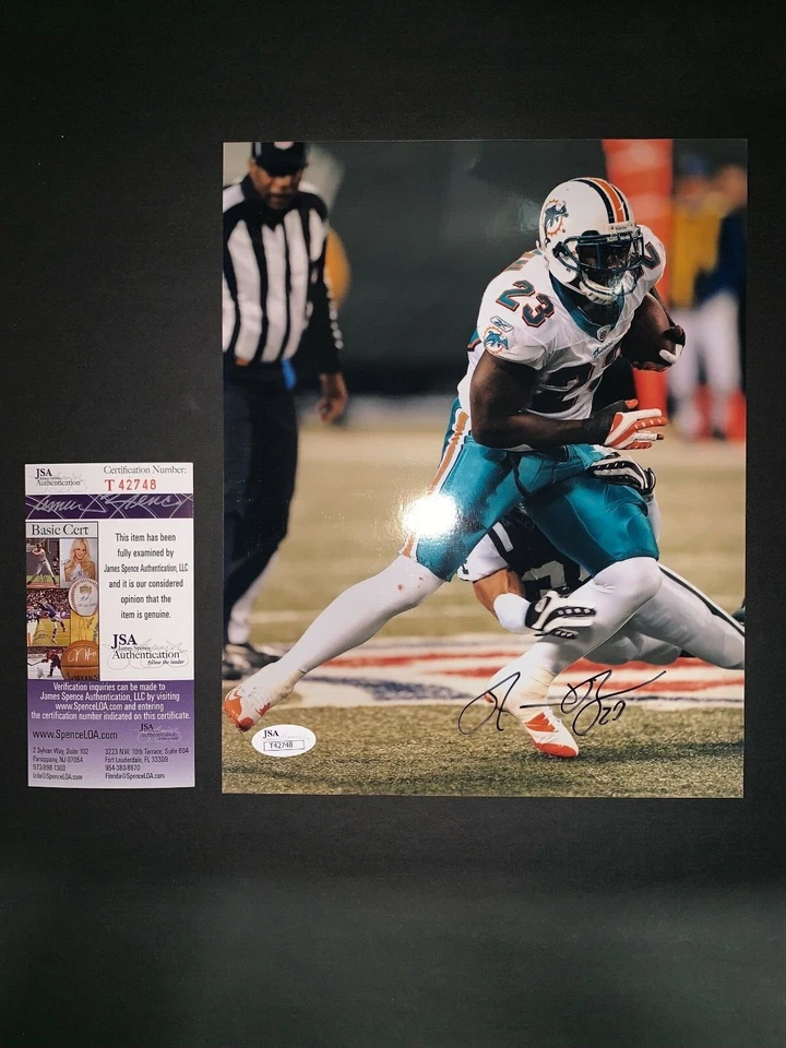 ФОТОГРАФИЯ РОННИ КОРИЧНЕВОГО МАЙАМИ ДЕЛЬФИНЫ С АВТОГРАФОМ 8X10 С СЕРТИФИКАТОМ ПОДЛИННОСТИ JSA T42748 - Изображение 1 из 1