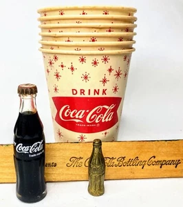 Coca-Cola: Waxed Paper Cups (6), 2 Mini Bottles (brass & glass) “Golden Ruler” - Picture 1 of 8