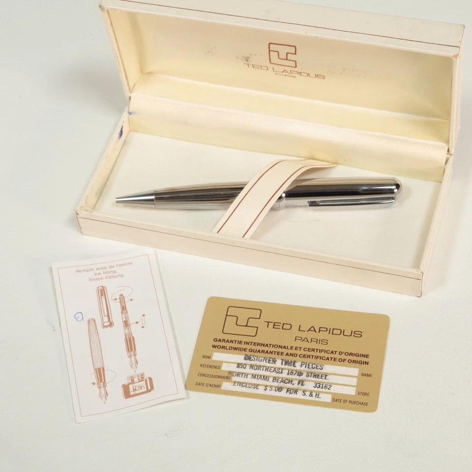 Bolígrafo Ted Lapidus plateado de acero inoxidable con tinta azul en estuche ¡Bonito! Foto 1 de 4