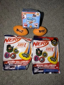NIP Nerf Glow Disc Launcher Lot of 2 + 2 World Smallest Mini Nerf Footballs - Picture 1 of 2