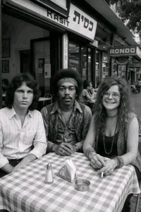 Jim Morrison/ Jimi Hendrix and Janis Joplin sitting at a Cafe Table - Picture 1 of 2