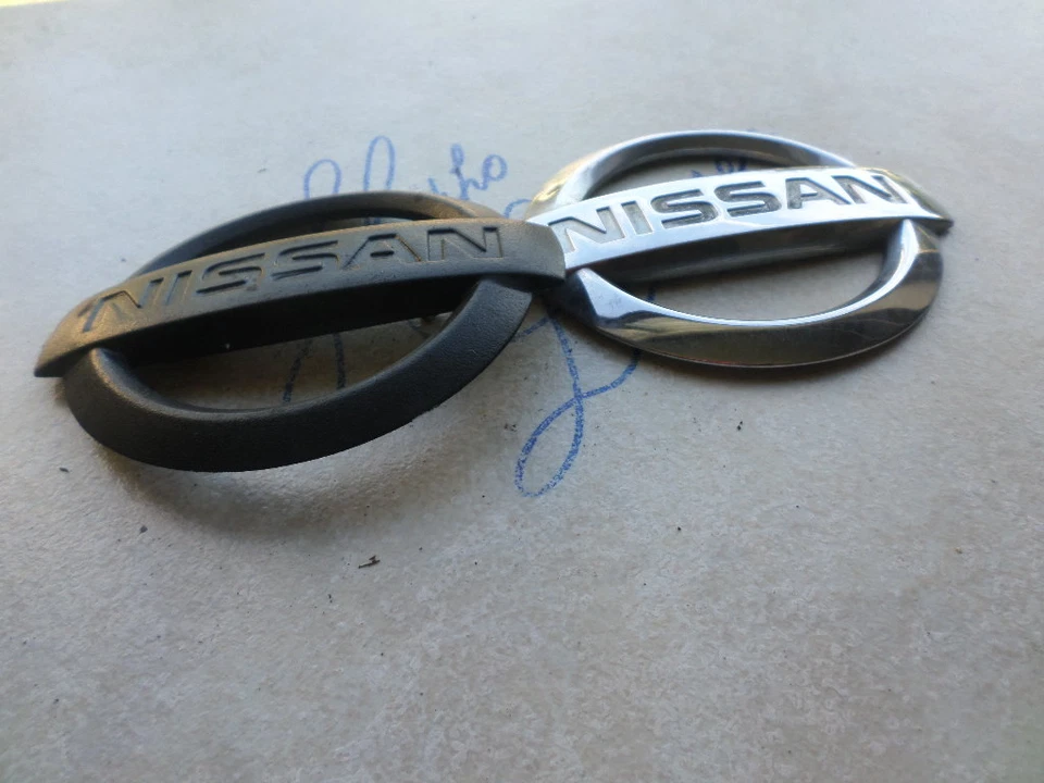 02-04 Nissan Xterra Front Logo 65890-7Z800 Trunk 93491-7Z800 Sticker Script Set - Image 1 of 1