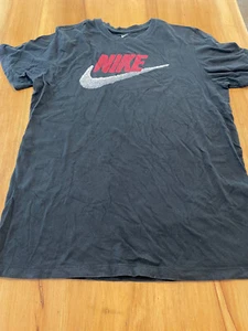 The Nike Tee Shirt Men's Large Black Short Sleeve Red logo with Blurred Swoosh - Picture 1 of 7