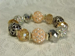 BRACCIALE ELASTICO CYNTHIA LYNN "CHAMPAGNE TASTE" ROSA CHAMPAGNE PERLINE ARGENTO - Foto 1 di 2