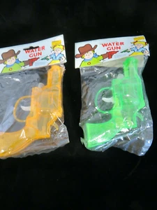 2 Vintage NIP Revolver Water Guns - Green & Orange Plastic - East West Dist. - Picture 1 of 6