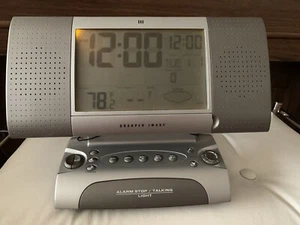 sharper image alarm stop/talking light/and radio /weather - Picture 1 of 7