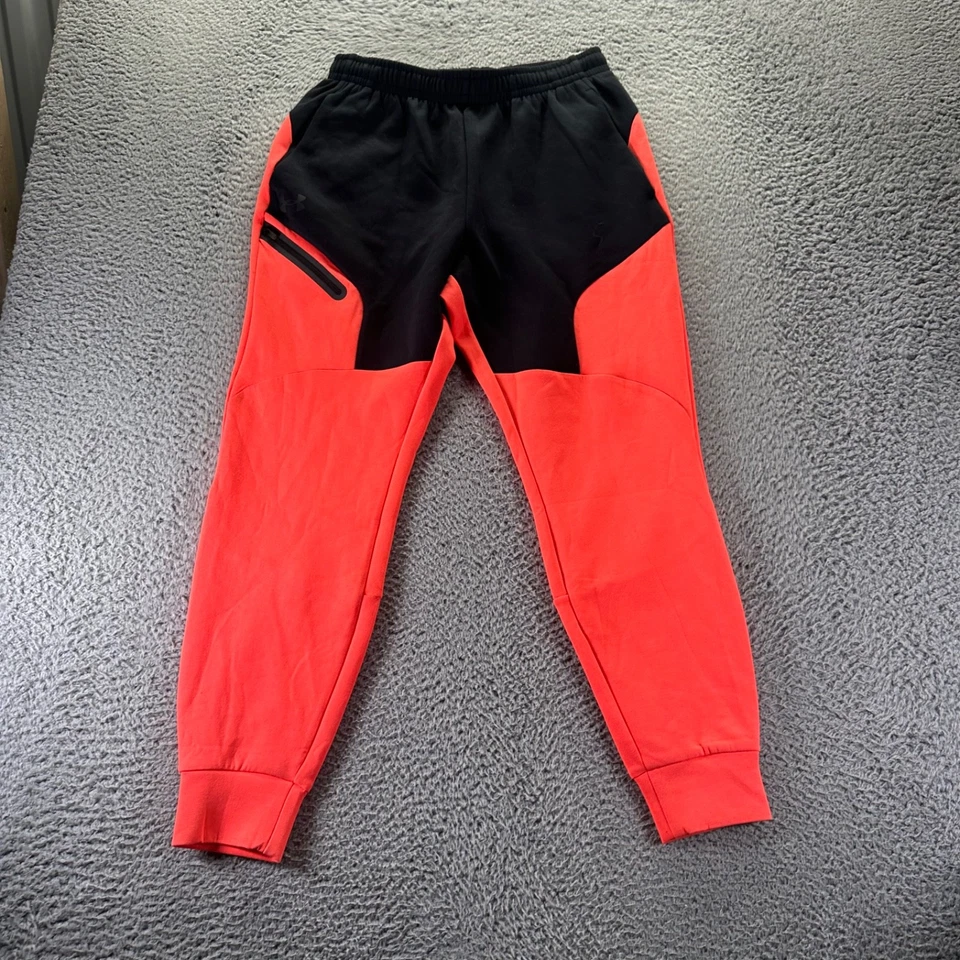 Pantalones deportivos Under Armour para hombre medianos naranja poliéster elástico ajuste cónico Foto 1 de 4