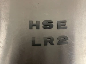 2010 - 2013 LAND ROVER LR2 Rear Trunk Emblem Letters - Picture 1 of 3