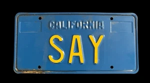 Vintage California Vanity Nummernschild "SAY" blau gelb geprägt Metall selten - Bild 1 von 2