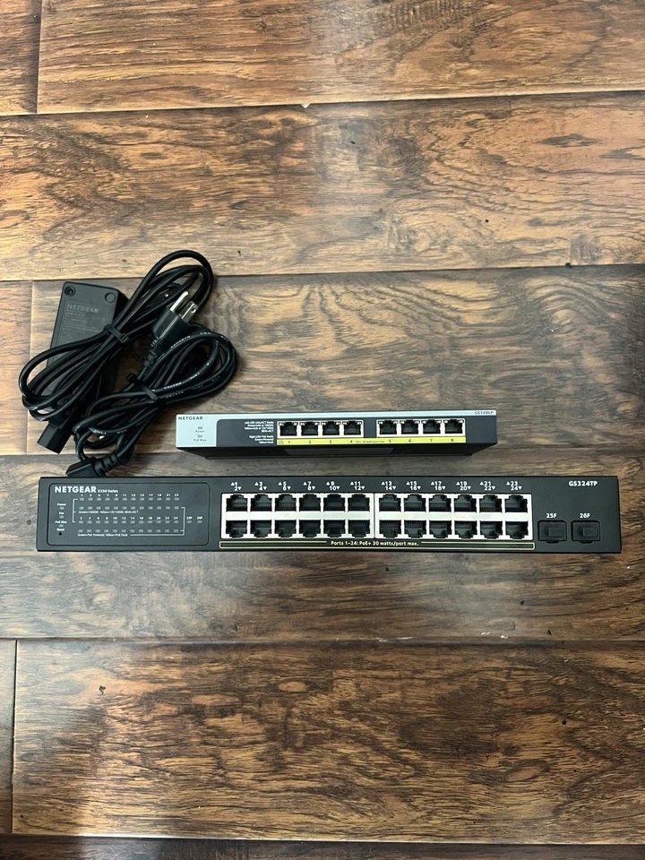 Netgear 24 Port GS324TP POE+ switch w/ 2 SFP & 8 port POE switch (2 switch lot). - Image 1 of 4