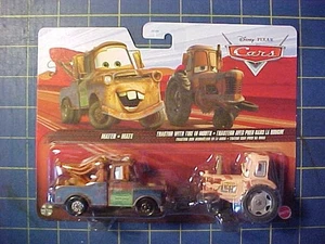 DISNEY PIXAR CARS MATER AND TRACTOR WITH TIRE IN MOUTH! 2 VEHICLE SET!  NIP - Picture 1 of 4