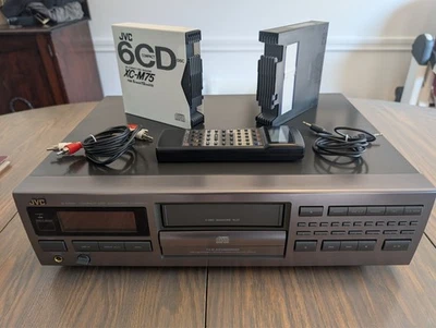 JVC XL-M509TN 6 Disc Plus 1 CD Player with 2 cartridges, audio cable, and remote - Image 1 of 3