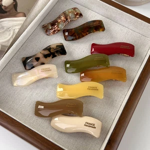 Fermagli per capelli donna in acetato ondulato clip laterale onda clip bordata stile francese vintage ∷ - Foto 1 di 20