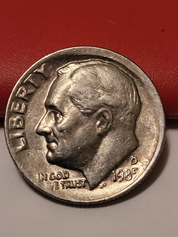 1985-D dime with partial collar or broad-struck error. Mis-aligned die? Cover