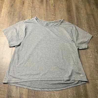 Camisa pulóver Nike Dri Fit para mujer talla mediana gris holgada manga corta Foto 1 de 4