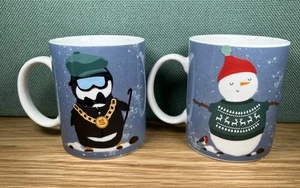 Pair Of 9.5 x 8cm PALADONE Christmas Ceramic Mugs Snowman Penguin Designs - Picture 1 of 12