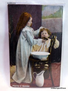 Postal vintage Happy Childhood J. W. B. Londres número 301 Jugando en mamás - Imagen 1 de 9