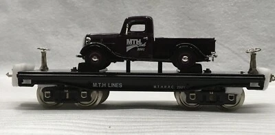MTH Tinplate Traditions 10-1163 MTHRRC 200 Series Flat Car w/ Purple Truck - Image 1 of 4