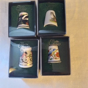 NIB-Thimble Collectors Club-4 Thimbles 2 Birds 1 Cat 1 Skunk Multicolored - Picture 1 of 8