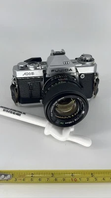 Пленочная камера Fujica AX-3 35 мм SLR с объективом X-Fujinon 55 мм f/1.6 DM непроверенная  - Изображение 1 из 4