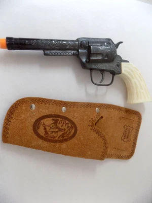 Pistola de casquillo diecast gris Toy Pony Boy de colección y funda de cuero genuino con enchufe de barril Foto 1 de 4