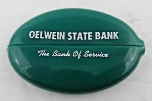 Portamonete vintage Oelwein State Bank verde ovale gomma Iowa - Foto 1 di 3