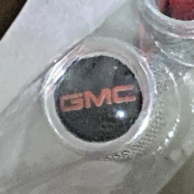 Tire Stem Valve Caps for GMC  Vehicles 4 Piece Covers Silver with Logo New - Image 1 of 2