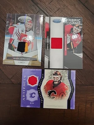 Miikka Kiprusoff 3 Card Jersey Lot Including 2010-11 Certified Mirror Gold /25 - Image 1 of 4