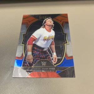 2023 Panini Select WWE "Rowdy" Roddy Piper #27 WWE Legends Red & Blue - Bild 1 von 2