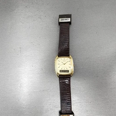Reloj digital analógico Seiko para hombre 29 mm esfera champán tono dorado H449-5109 PIEZAS Foto 1 de 4