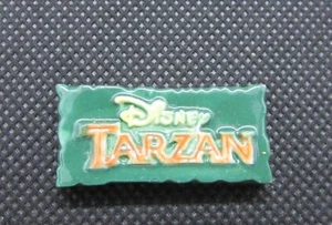 Fève Série Tarzan " L'affiche " Disney #G47 - Foto 1 di 2
