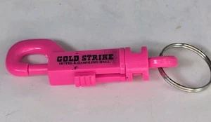 KEYCHAIN Gold Strike Hotel & Gambling Hall With Hook (VINTAGE) - Pink - Picture 1 of 2