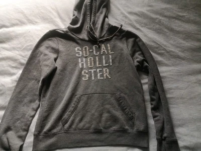 Hollister Women’s hoodie Size Medium hooded sweatshirt top mid grey sparkly logo - Image 1 of 4