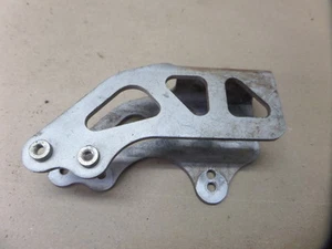 2006 KTM 250 SX CHAIN GUIDE BLOCK SLIDER MOUNT BRACKET REAR LOWER - Picture 1 of 3