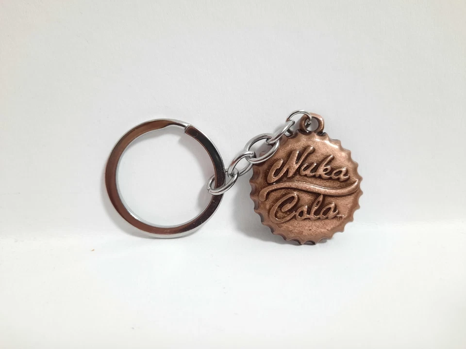 Fallout 4 Nuka Cola Schlüsselanhänger Kronkorken Kupferfarbig Limitiert Neu - Bild 1 von 3
